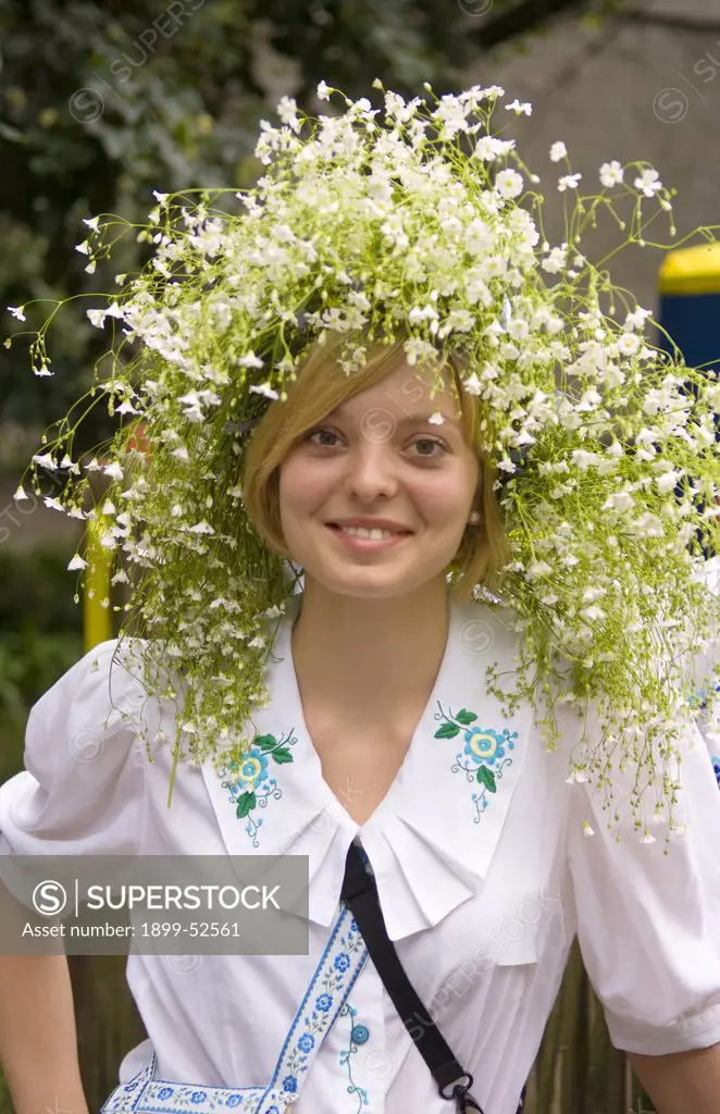 Woman In Traditional Dress In Kiev, Ukraine, With Flowers In Her Hair
