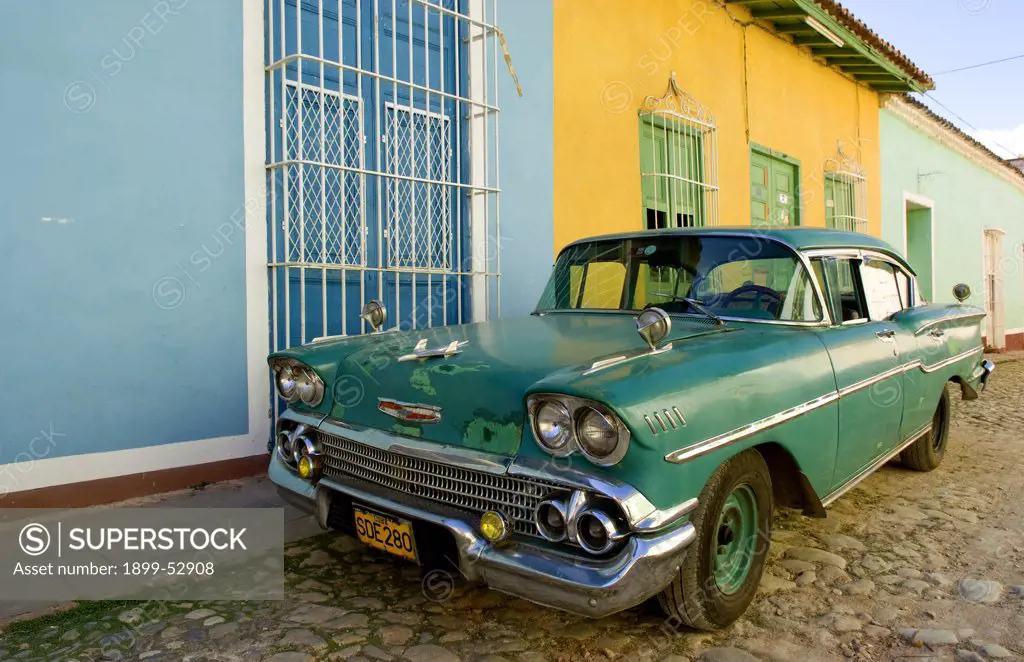 1958 Classic Chevy On Cobblestone Street In Center Square Of Trinidad, Cuba.