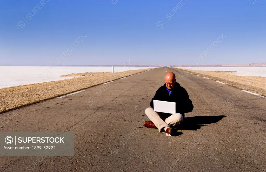 Man On Computer, Sahara Desert, Tunisia, Africa