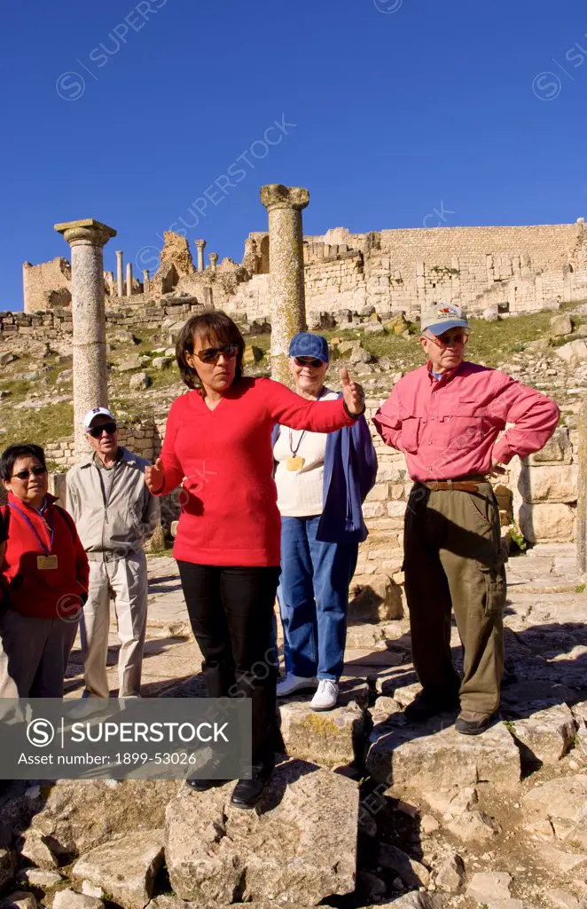 Guide Showing Tourists The Brothels In 2Nd Century Roman Ruins, Dougga, Tunisia