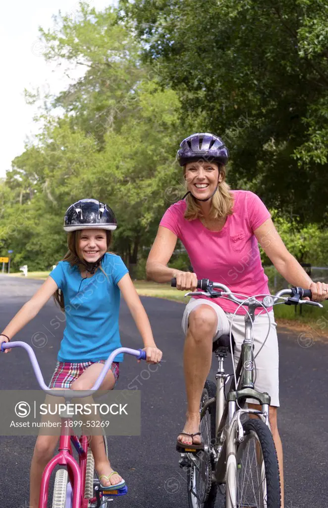 Mother And Daughter With Bikes
