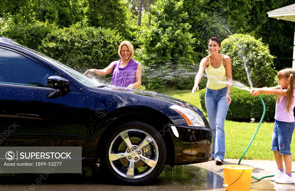 Child And Women Washing Car Together