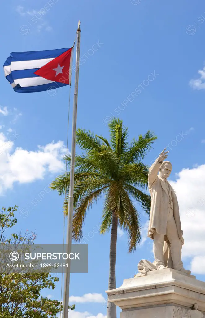 Cuban Flag And Statue Of Jose Marti In Center Of Town Of Cienfuegos, Cuba