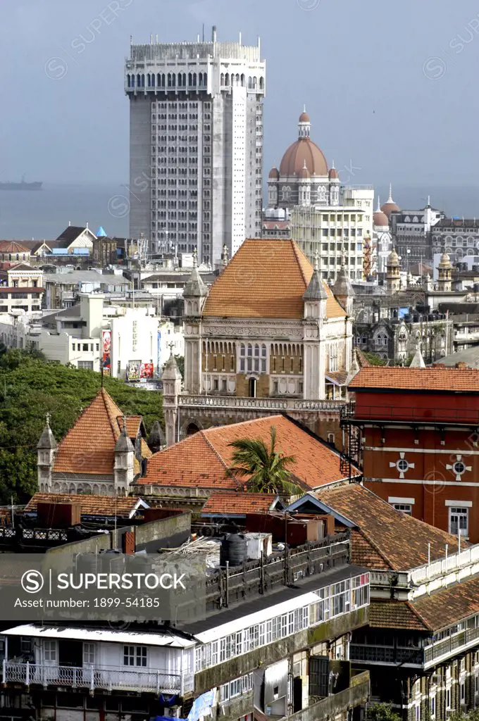 India. Maharashtra, Mumbai. Manglorean Tiled Buildings With Hotel Taj Mahal In Background