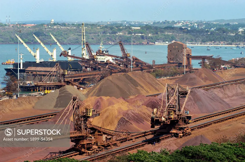 Iron Ore Waiting To Be Loaded On To Bulk Carrier Ships In The Filled To Capacity Mormugao Port Trust Dock At Vasco In South West Goa, India