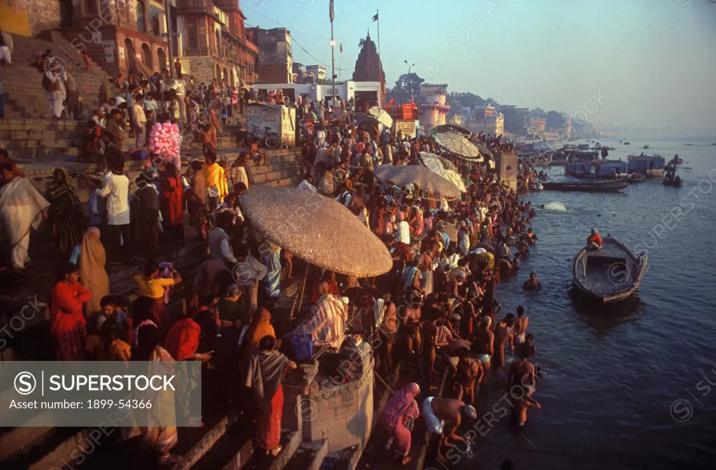 Crowd Of People For Bathing In The Holy River Ganges In The Oldest Indian City Of India, Banaras, Now Varanasi, Uttar Pradesh, India.