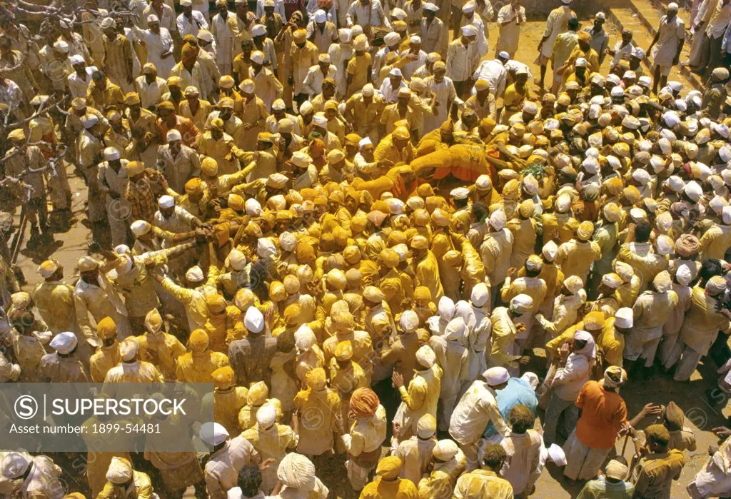The Belief That Khandoba'S Power Will Be Bestowed Upon Those Who Maintain Contact With The Pole For The Longest Time Draws Devotees Near The Palanquin, Jejuri, Maharashtra. India