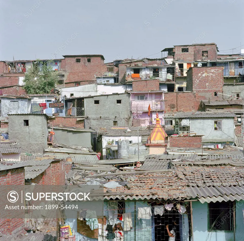 A View Of A Slum Settlement On Aslope With Houses Made Of Cheap And Often Recycled Materials, Sharing Common Walls. Mumbai, India