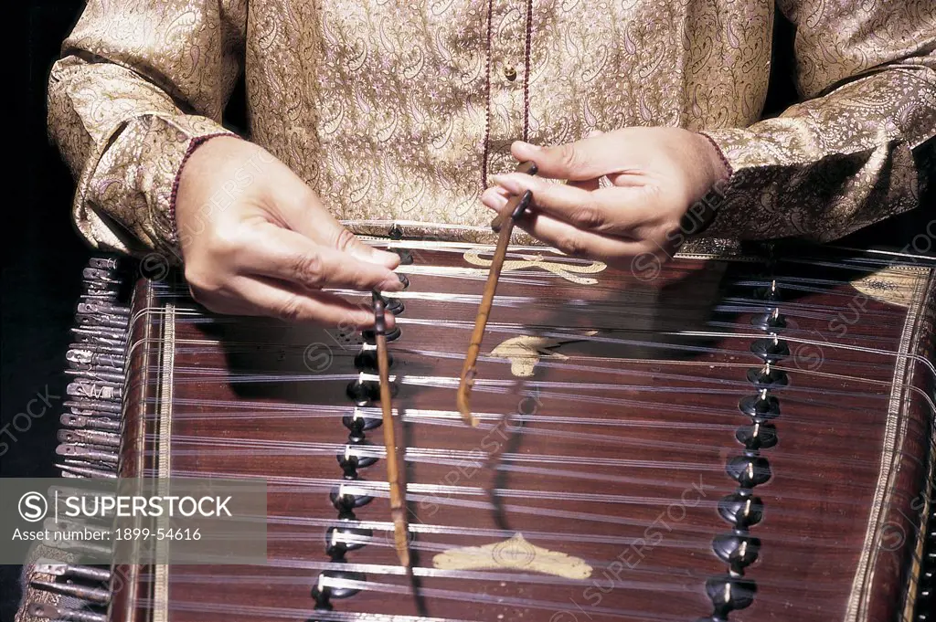 Close Up Of Both Hands Of Indian Classical Musician Playing Musical Instrument Santoor In Concert, India