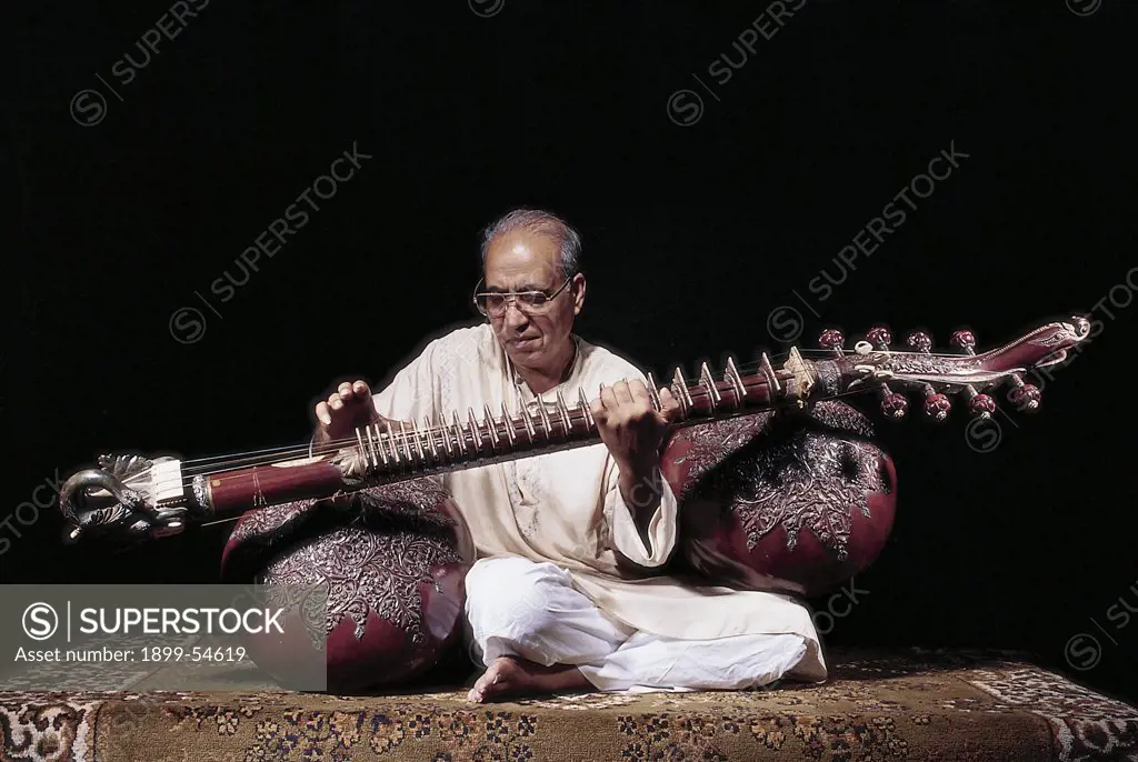 Portrait Of Indian Classical Music Musician Playing Musical Instrument Rudra Veena In Dhrupad In Concert, India