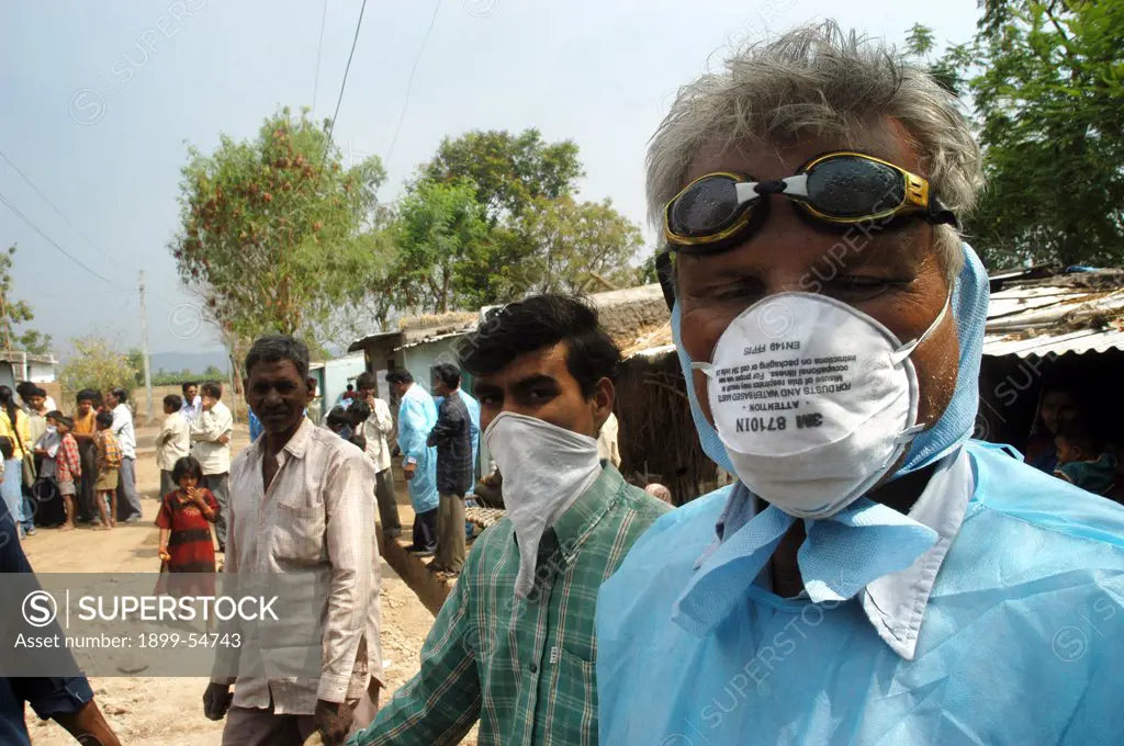 Health Workers Cover Their Faces With Protective Masks As The Go House To House To Cull Infected Chickens In The Backyard Of The Villager'S Houses At Hingona Village In Jalgaon District As Bird Flu Is Detected In Maharashtra, India