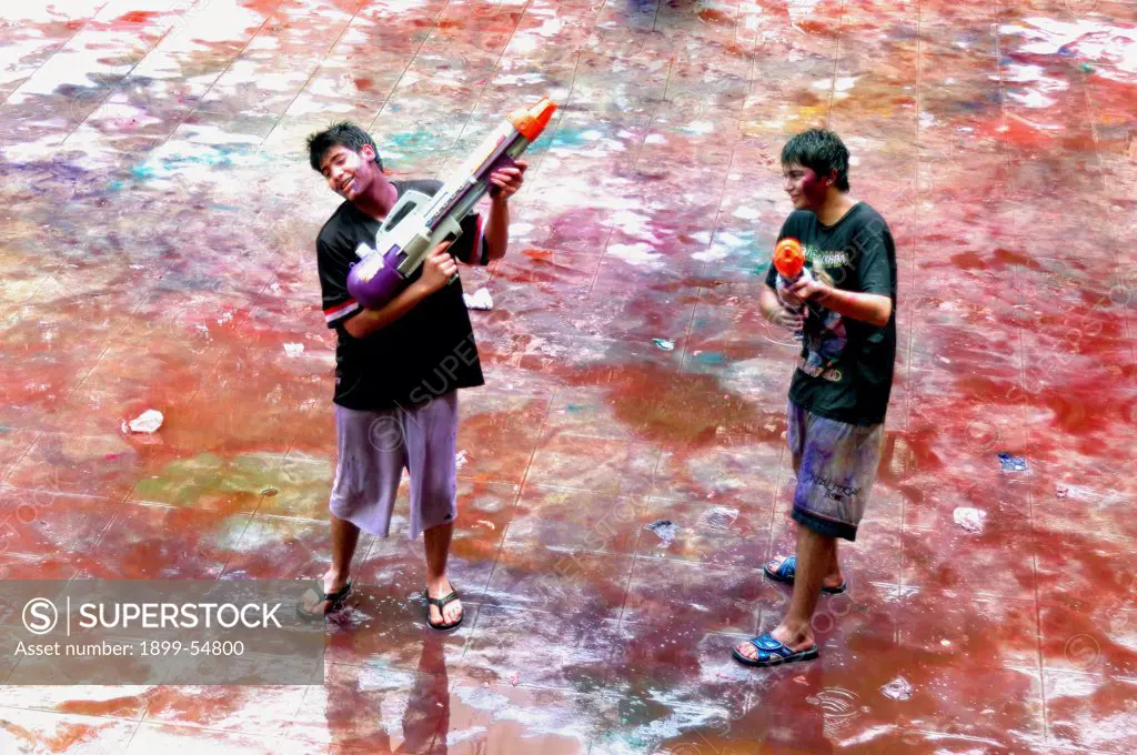 Two Boys Playing Holi Festival Of Color, At Ananta Apartments At Breach Candy, Bombay Mumbai, Maharashtra, India