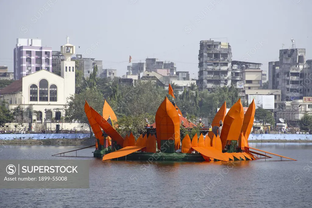 Man Made Orange Lotus Surrounding The Mahadev Mandir In Masunda Lake And Saint John The Baptist Church During Thane Festival, Thane, Maharashtra, India
