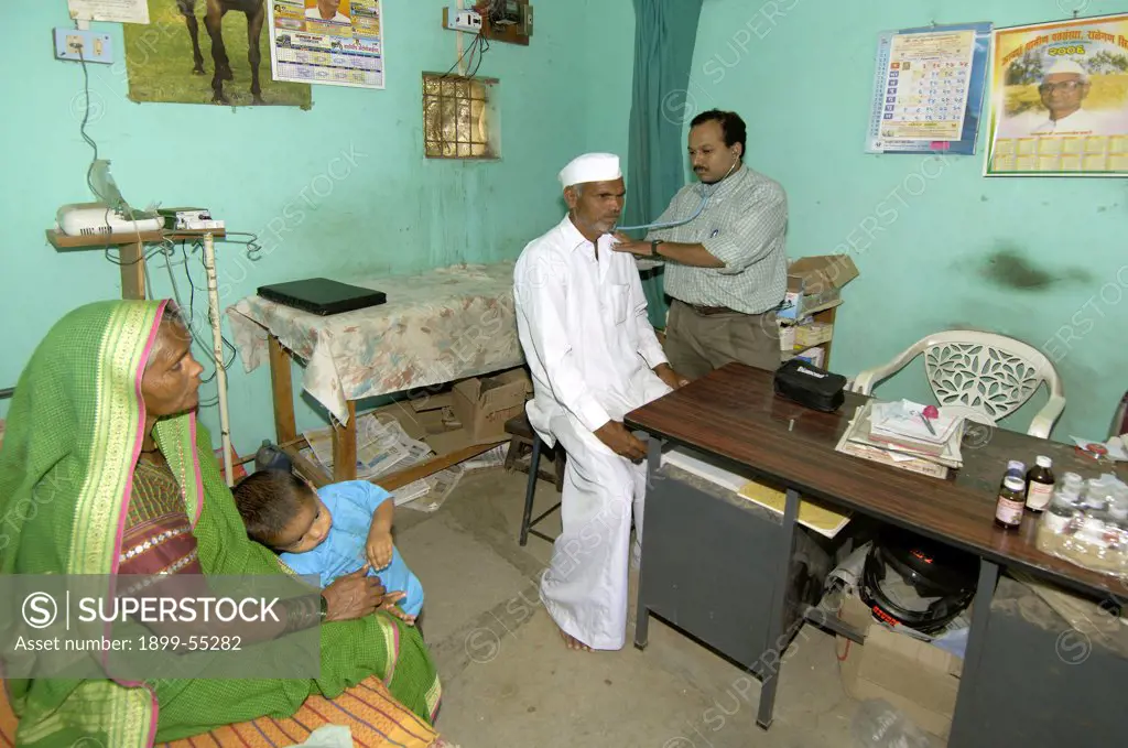 Doctor Examining Villagers At Private Clinic At Ralegan Siddhi Near Pune, Maharashtra, India