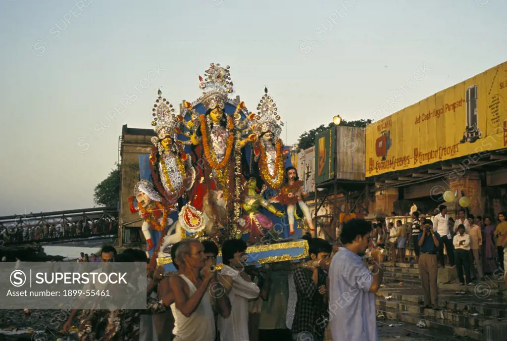 India, Calcutta, West Bengal. Durga Puja Festival. Men Carrying Float In Procession