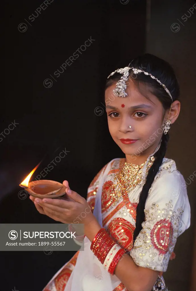 India, Diwali (Deepavali) Festival (Oct/Nov). Young Girl With Oil Lamp