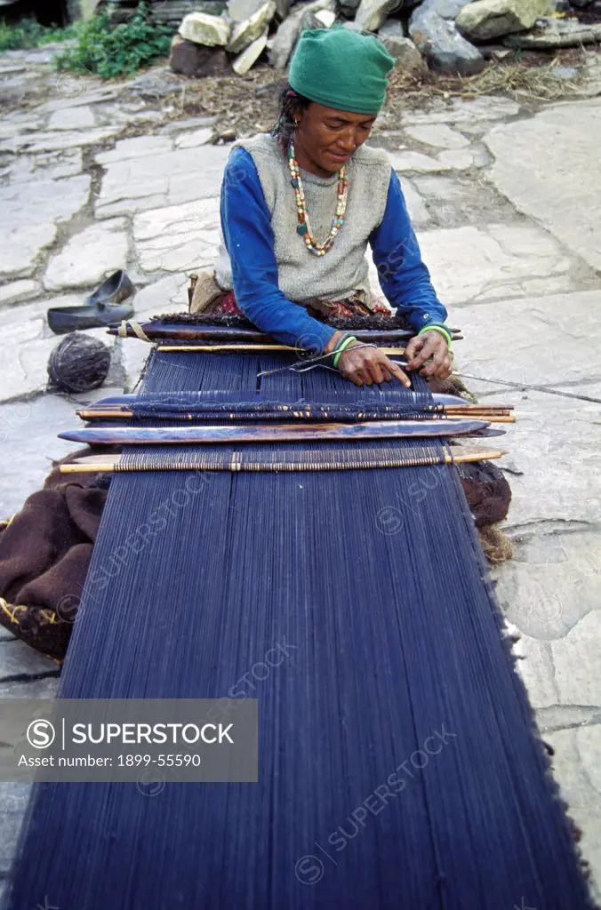India, Kumon Himalayas. Woman Weaving On Handloom