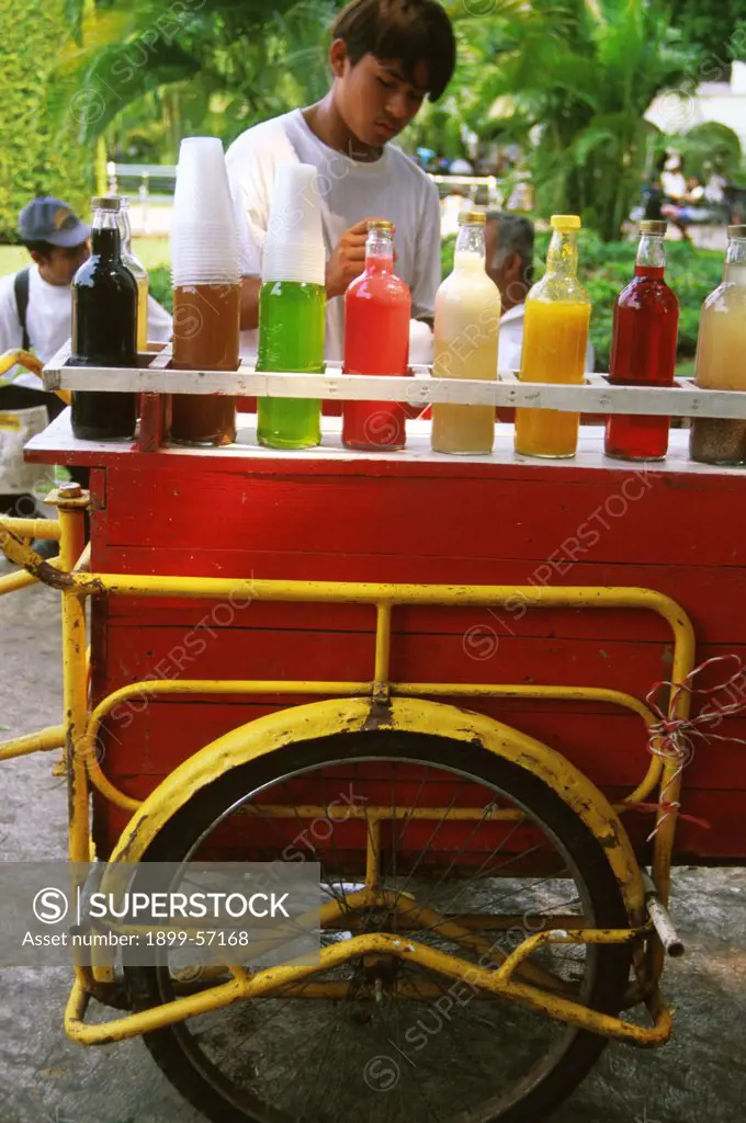 Mexico, Merida. Plaza Major. Juice Vendor Selling From Cart.
