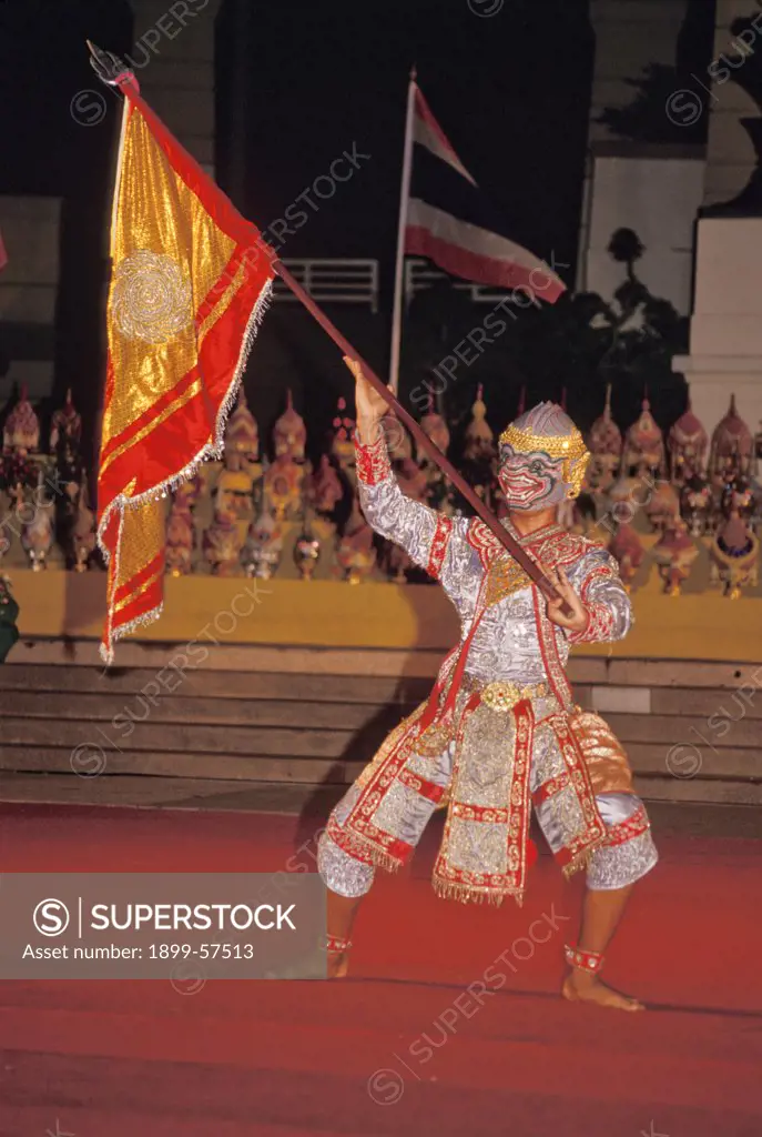 Thailand. Bangkok. Ramayana Performance. Masked Performer Waving Flag.