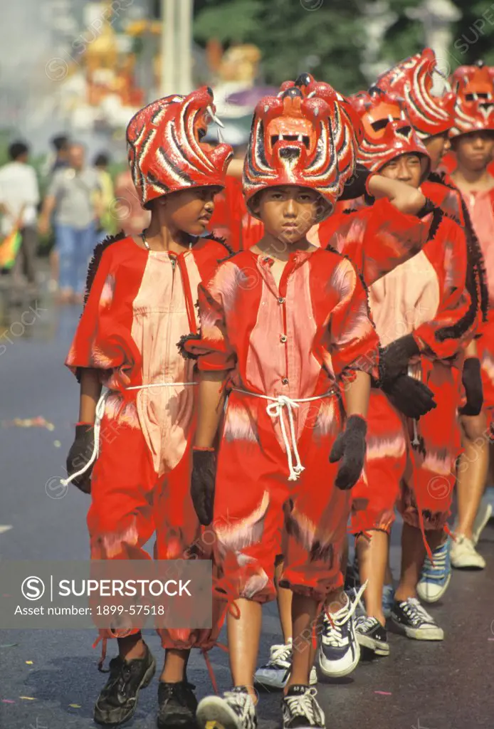 Thailand. Bangkok. Songkran Parade. Boys In Red Costumes.