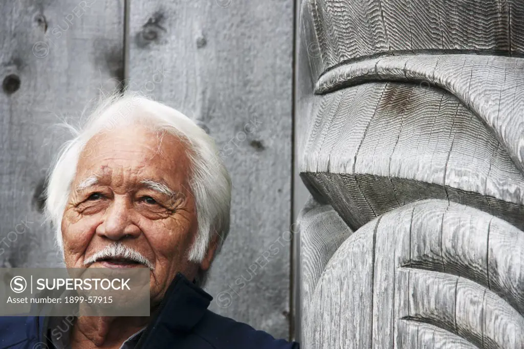Master Carver Of Frontal Pole For Carving House At Haida Heritage Centre Near Skidegate, B.C., Canada