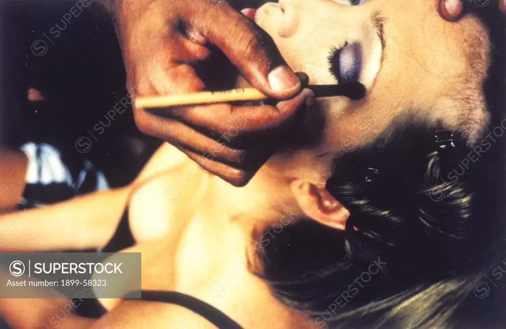 Makeup Artist Applying Makeup To WomanS Eyes