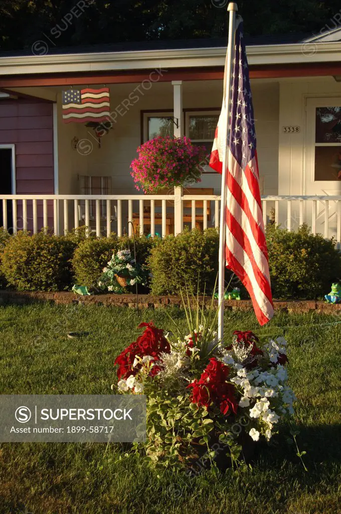 American Flag In Front Of Home.