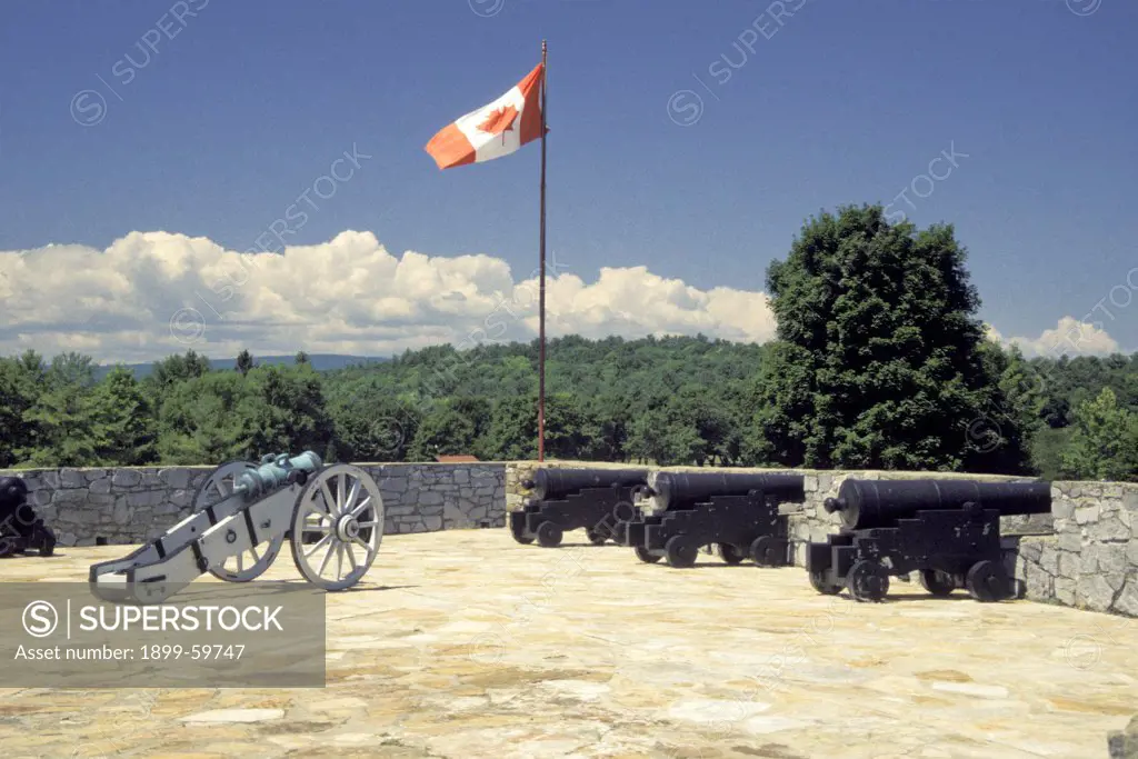 New York, Fort Ticonderoga, Fort With Weapons, Tanks And Cannon Ball And Canadian Flag Flying.