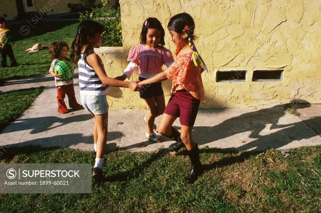 California, Los Angeles. Children Playing Ring Around The Rosie
