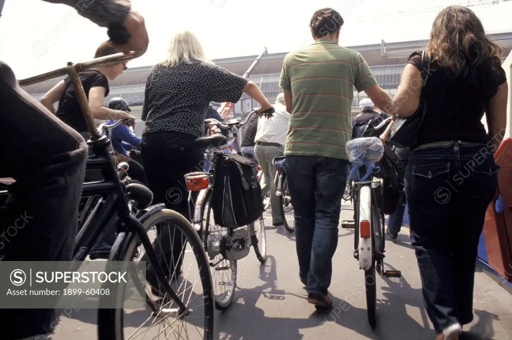 Netherlands. Amsterdam. Near Centraal Station. Cyclists Disembarking From Ferry. Bicycles.
