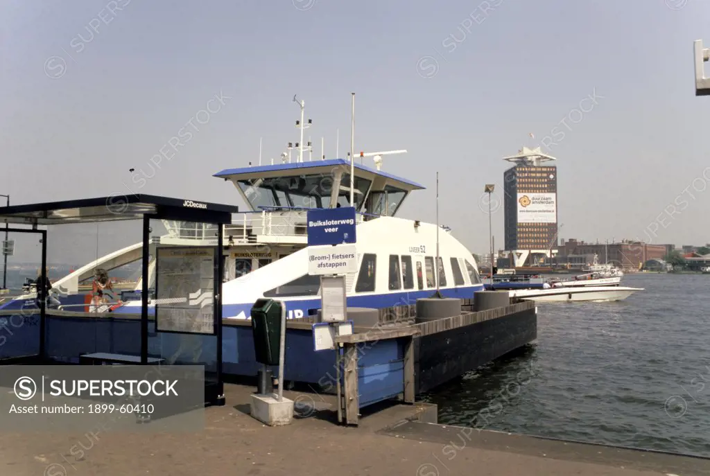 Netherlands. Amsterdam. Near Centraal Station. Ferry At Dock. Boats. Harbor. Het Ij.