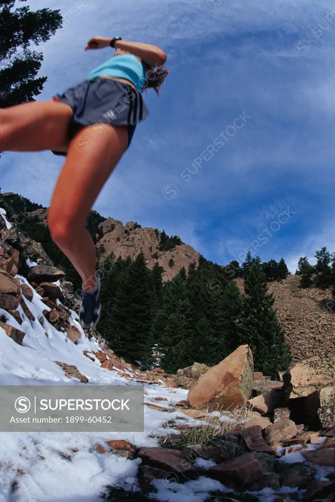 Colorado, Boulder, Chautauqua Park. Woman Running On A Climbing Access Trail.