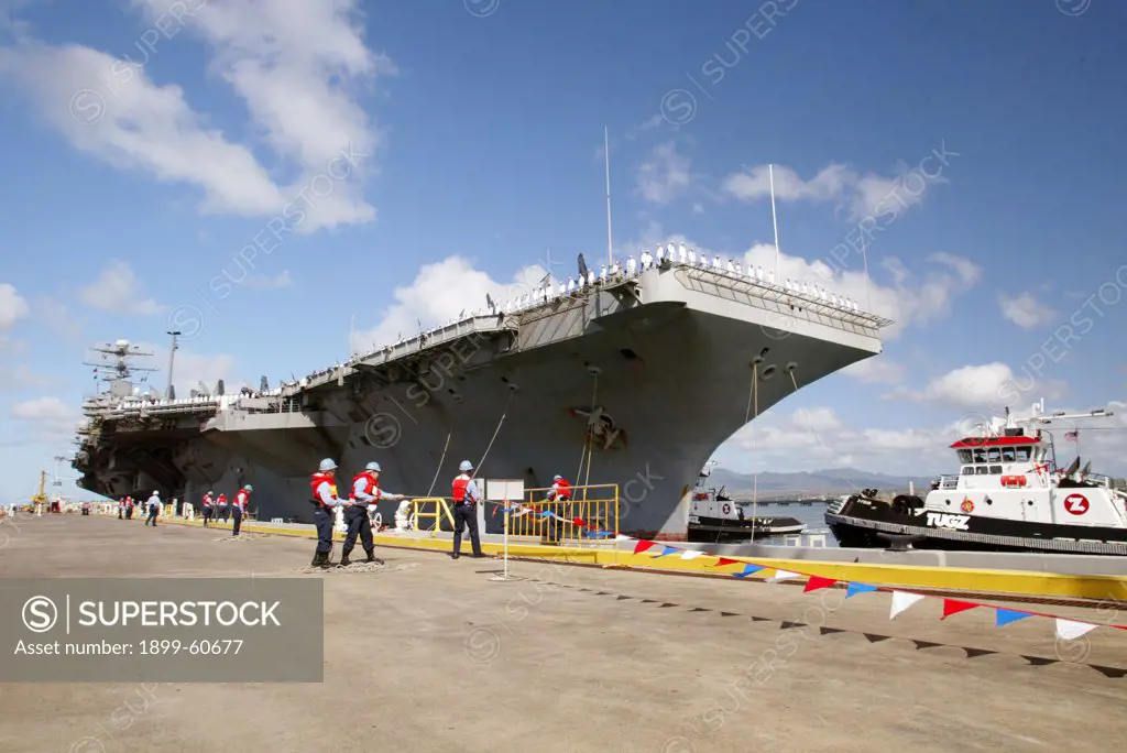 Hawaii, Honolulu. Aircraft Carrier Uss Abraham Lincoln Pulling Into Pearl Harbor Following Deployment In Iraq War.