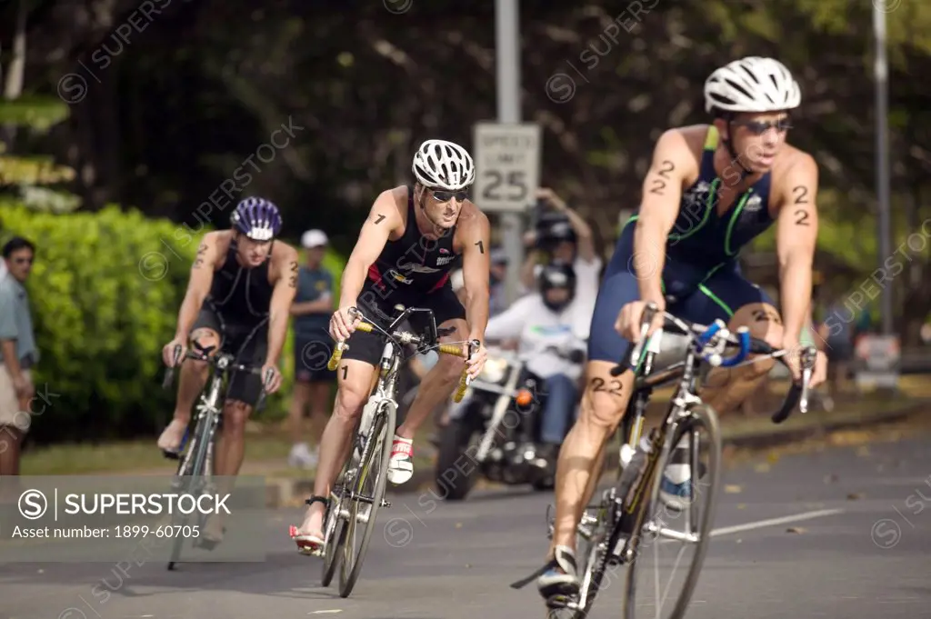 Honolulu, Hawaii - Bicyclists Round A Corner During The Bike Leg Of The 2004 Usa Triathlon Olympic Qualifier Race.