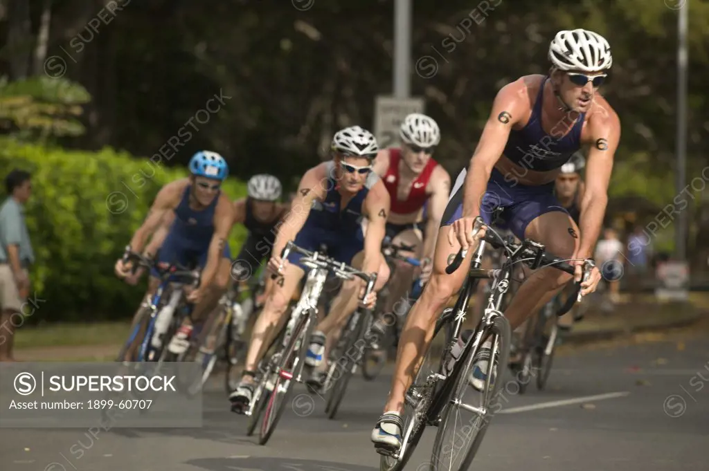 Honolulu, Hawaii - Bicyclists Round A Corner During The Bike Leg Of The 2004 Usa Triathlon Olympic Qualifier Race.