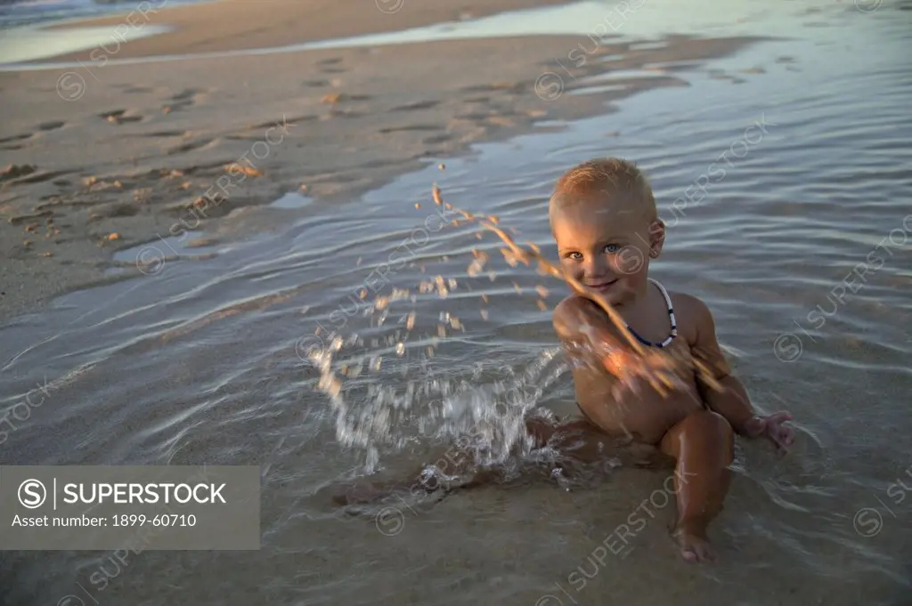 18 Month Old Girl Playing In Tidal Pool. Oahu, Hawaii