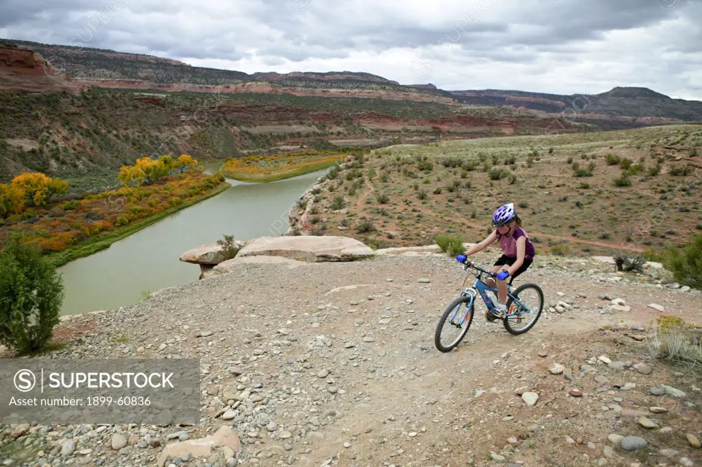 Young Girl (8) Mountain Biking On The Rustler Trail Above The Colorado River Near Fruita, Colorado.
