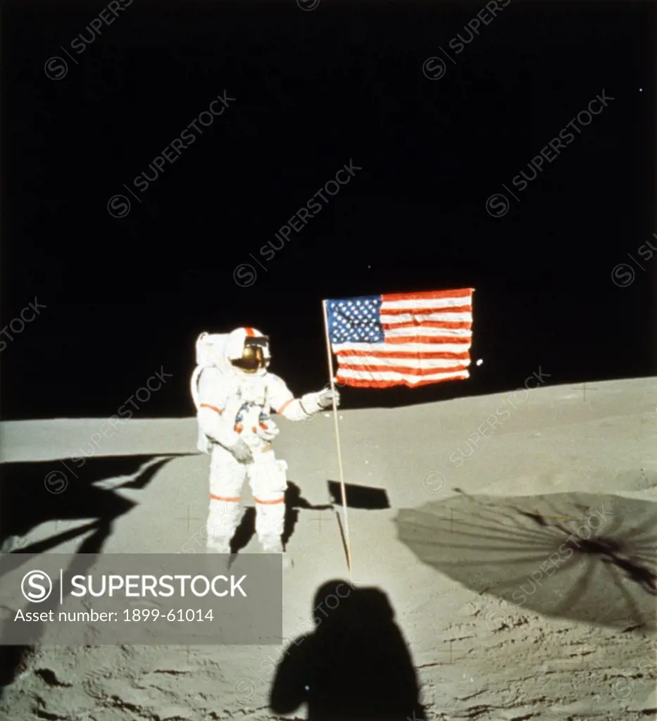 Astronauts, Shepard, Apollo 14, Stands With U.S. Flag On The Moon.