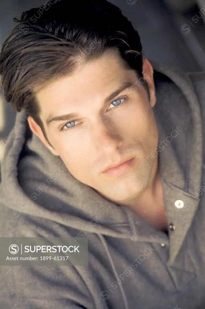 Portrait Of Man Wearing Grey Hooded Sweatshirt