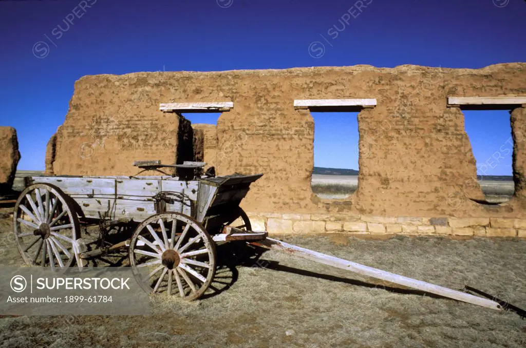 New Mexico, Fort Union. Adobe Building And Old Wagon