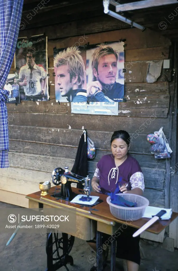 Thailand. Woman Using Treadle Sewing Machine.