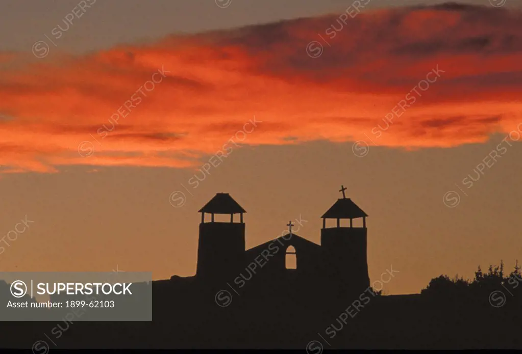 New Mexico, Cerrillos. Silhouette Of Church At Sunset