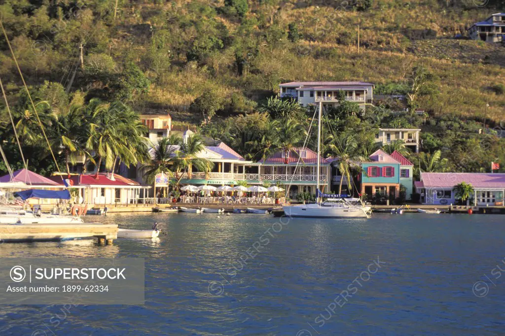 Caribbean, British Virgin Islands, Tortolla. Harbor With Boats And Colorful Houses.