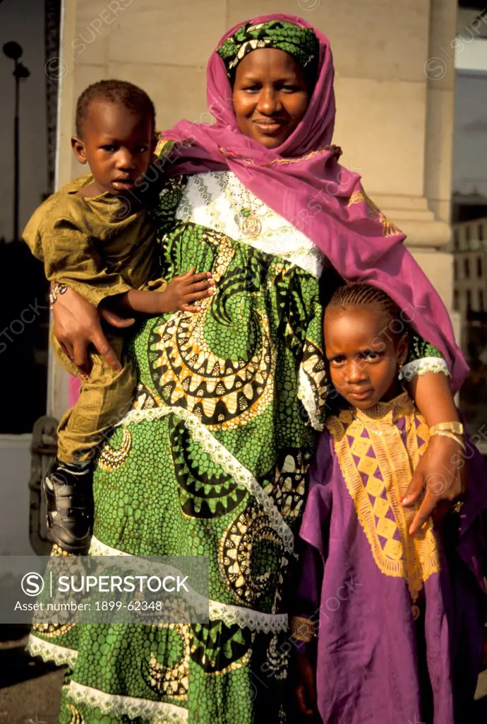 Portrait Of Mother And Two Children In Traditional African Dress.