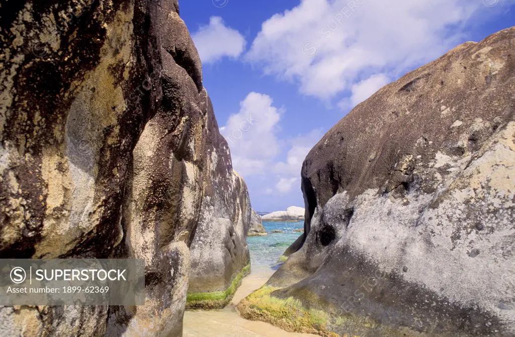 British Virgin Islands, Virgin Gorda. Sliver Of Ocean Seen Between Two Large Rocks