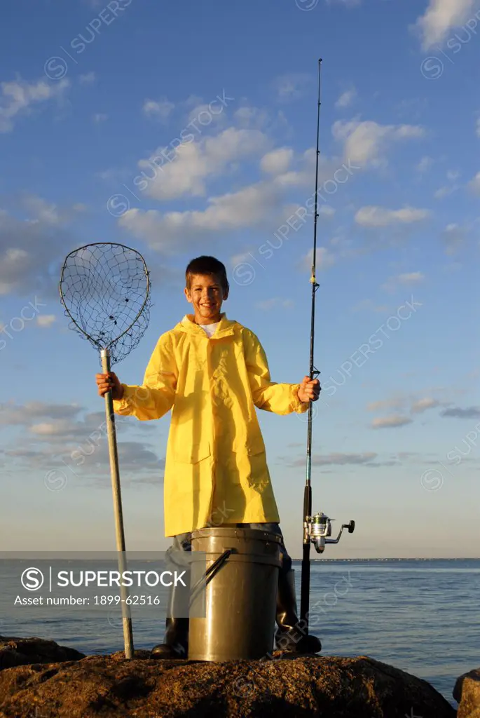 Boy With Fishing Gear In Yellow Slicker Martha'S Vineyard, Massachusetts