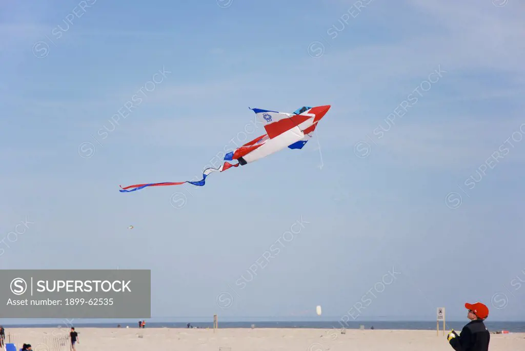 7 Year Old Boy Flying Kite At Jones Beach, New York