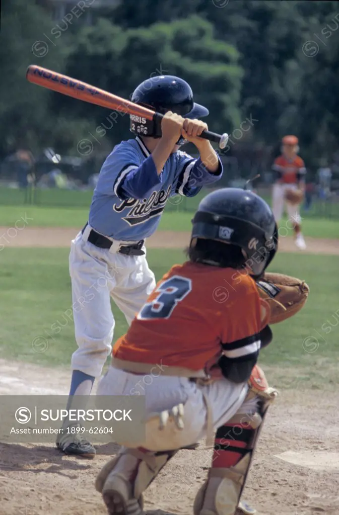 California. Youth League Baseball Game. Batter And Catcher.