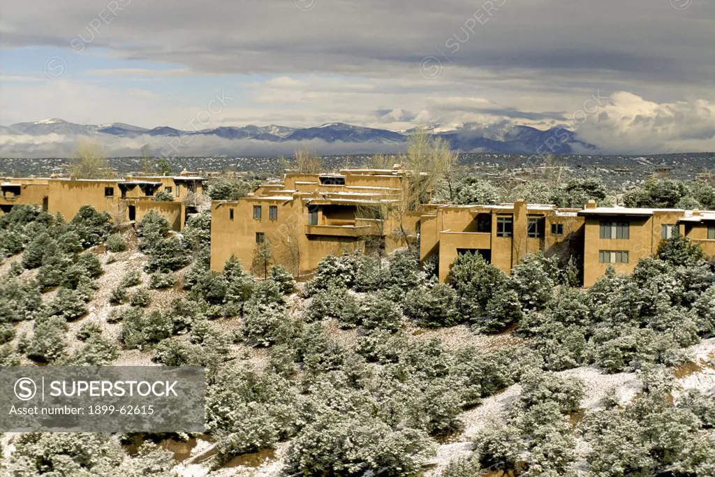 New Mexico. Sante Fe. Adobe Homes In Winter. Jemenez Mountains In Background.