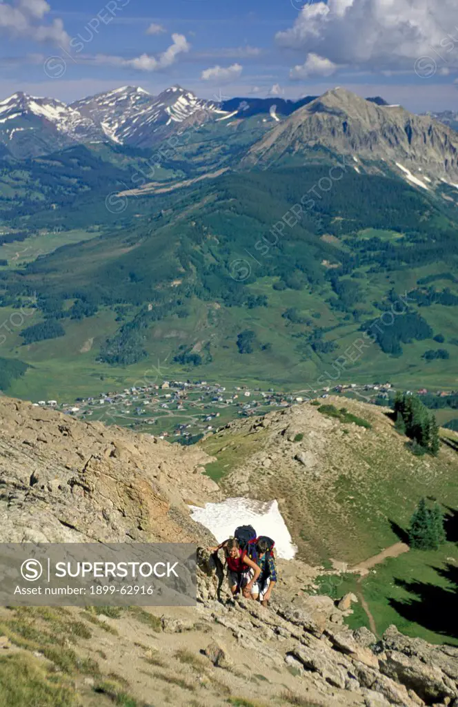 Colorado, Crested Butte. Couple Backpacking Up Mt. Crested Butte.
